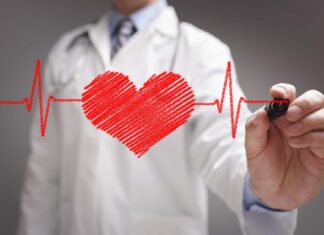 Doctors Hand Drawing Heartbeat Line Wallpaper