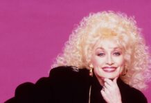 Dolly Parton Iconic Style Pink Background Wallpaper