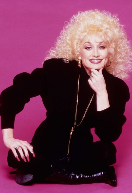 Dolly Parton Iconic Style Pink Background Wallpaper