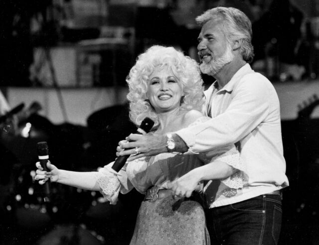 Dolly Parton Performing Live On Stage Black And White Wallpaper