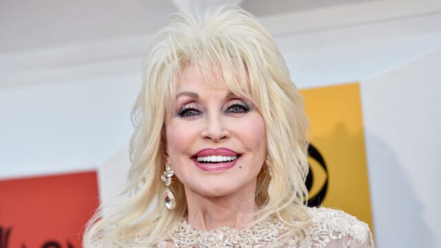 Dolly Parton Smiling Portrait High Quality Wallpaper