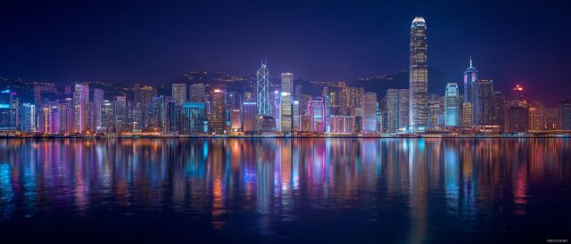 Dual Monitor Images Wallpaper For Desktop, A Dynamic Urban Skyline With Skyscrapers Illuminated At Night, Suitable For Dual Monitor Setups