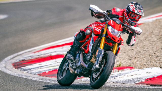 Ducati Hypermotard 950 Racing on Track Sharp Lean Angle High Performance Motorcycle Wallpaper
