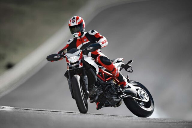 Ducati Hypermotard 950 Riding on Track with Rider in Red Black Gear Wallpapers