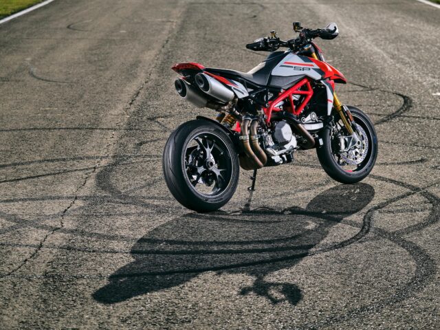 Ducati Hypermotard 950 SP Red and Black Motorcycle on Asphalt Track Wallpaper