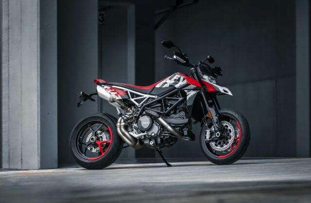 Ducati Hypermotard 950 Stunning Red and White Motorcycle Wallpaper in Urban Setting