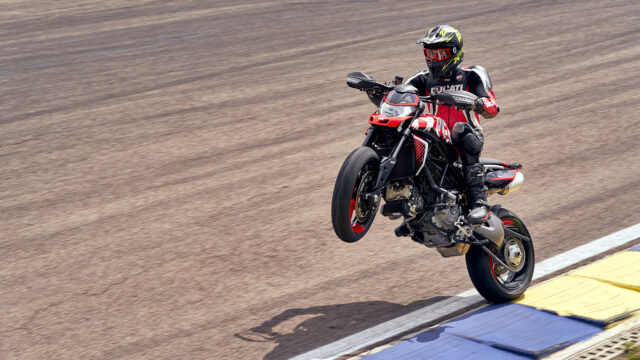 Ducati Hypermotard 950 Wheelie Action on Track Stunning Motorcycle Wallpaper