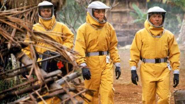 Dustin Hoffman In Protective Suit Walking Through Jungle Scene Wallpaper