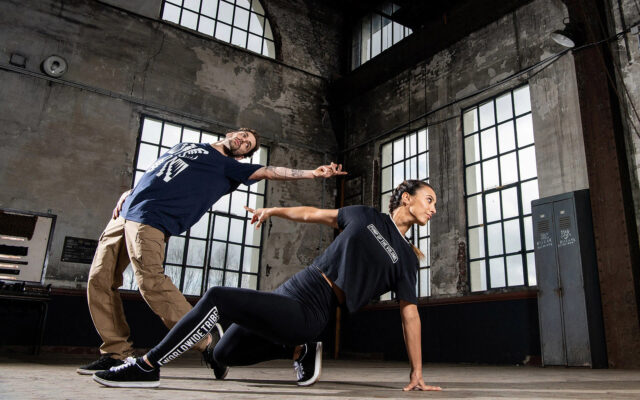 Dynamic Breakdancing Duo Performance In Urban Setting