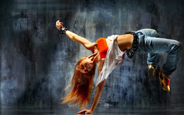 Dynamic Breakdancing Move Captured In Stunning Wallpaper