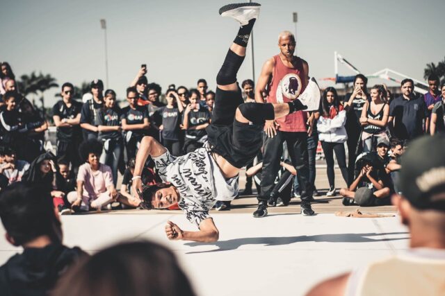 Dynamic Breakdancing Performance Captured In Urban Setting