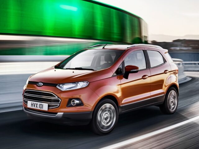 Dynamic Ford EcoSport On Urban Roadway Wallpaper