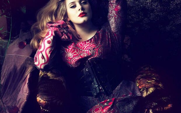 Adele Wallpapers feature a woman wearing a vibrant, patterned dress lying down, HD Mobile Wallpaper