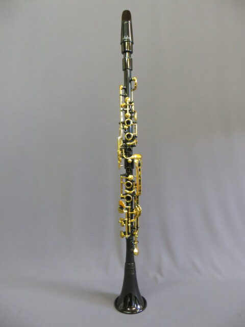 Elegant Clarinet Silhouette On Gray Background Perfect Wallpaper Choice
