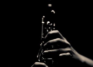 Elegant Clarinet In Shadow Minimalist Wallpaper
