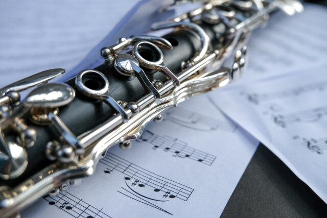 Elegant Clarinet On Sheet Music Background For Wallpapers