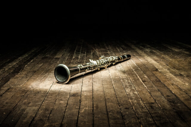 Elegant Clarinet On Wooden Floor Clarinet Wallpaper Image