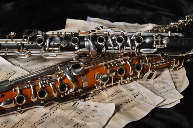 Elegant Clarinets With Sheet Music Background Wallpaper