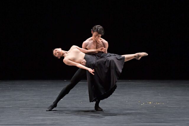 Elegant Contemporary Dance Performance with Male and Female Dancers on Stage