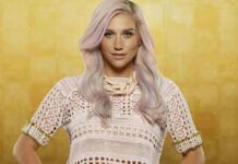 A portrait of Kesha wearing a detailed crochet top and beige necklace with pastel pink hair against a golden background, HD Desktop Wallpaper