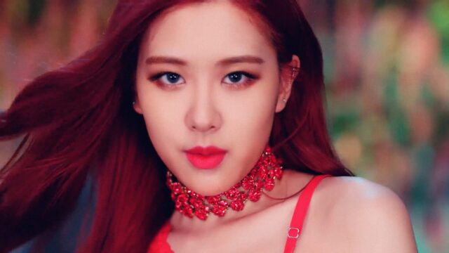 Elegant Red Floral Choker Wallpaper with Woman in Red Dress Closeup