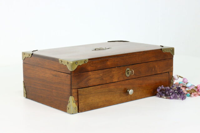 Elegant Wooden Jewelry Box With Colorful Beads Background