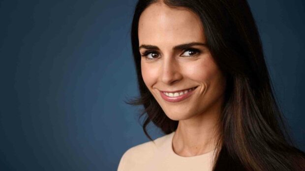 Jordana Brewster smiles gently against a blue background in this portrait, HD Desktop Wallpaper
