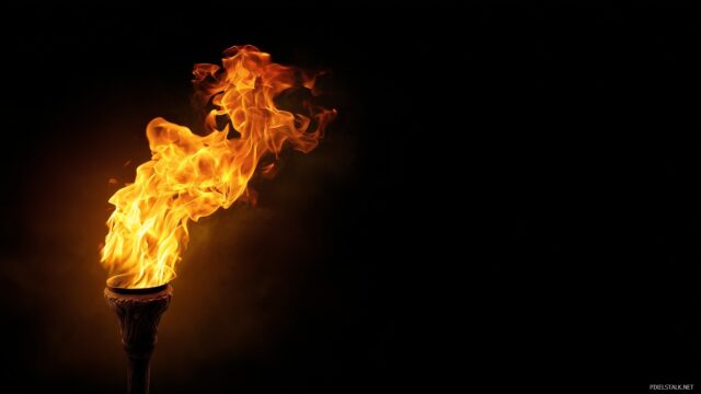 Fire Wallpaper HD For Desktop, A Vivid Portrayal Of A Torch Flame Against A Dark Canvas, Designed To Ignite Inspiration On Your Desktop