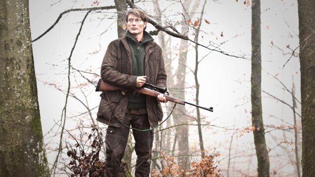 Forest Hunter With Rifle Mads Mikkelsen Wallpaper