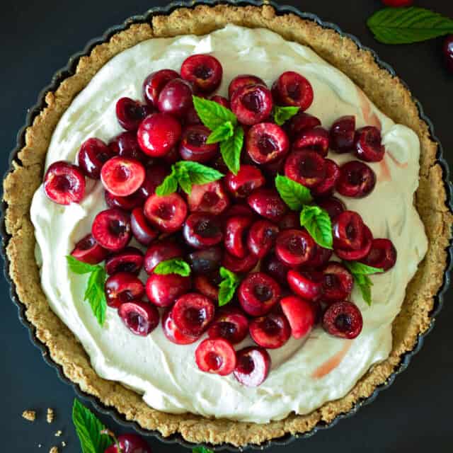 Fresh Cherry Tart with Cream and Mint Leaves Tart Wallpapers Background