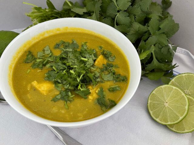 Fresh Cilantro Garnished Soup with Lime Slices and Green Herbs Wallpaper