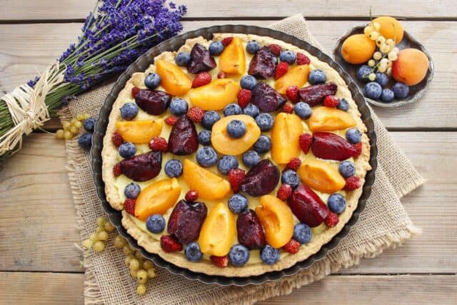 Fresh Fruit Tart with Blueberries Apricots and Plums on Rustic Wooden Table Tart Wallpapers