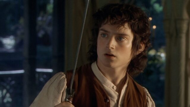 Frodo Holding Sword Majestic Wallpaper