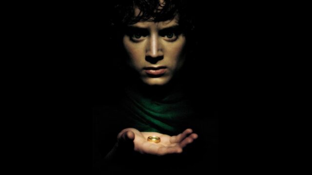 Frodo Holding The One Ring Iconic Lord Of The Rings Wallpaper