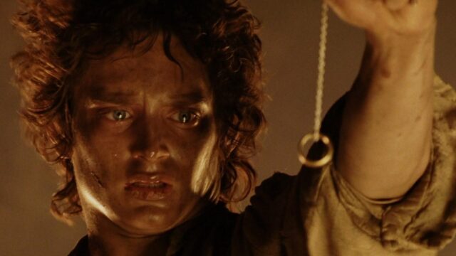 Frodo Holding The One Ring Iconic Wallpaper For Fans