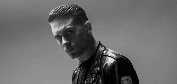 G Eazy looks intensely at the camera wearing a leather jacket, 2K Desktop Wallpaper