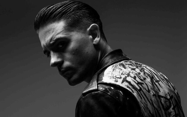 G Eazy is shown wearing a detailed leather jacket in a dramatic black and white close up, 2K Desktop Wallpaper