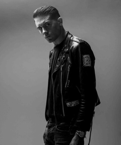 G Eazy wallpapers show him wearing a detailed leather jacket with a serious expression, HD Mobile Wallpaper