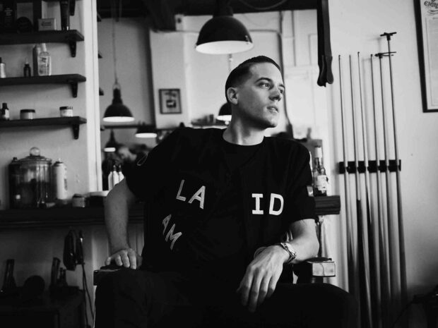 G Eazy is sitting in a barbershop looking to the side thoughtfully, HD Desktop Wallpaper