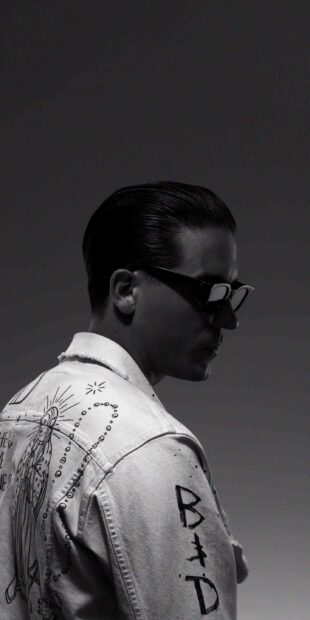 G Eazy wearing sunglasses and a decorated jacket in a black and white photo, 2K Mobile Wallpaper