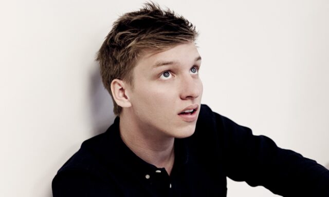 George Ezra Close Up Portrait Wallpaper with Thoughtful Expression