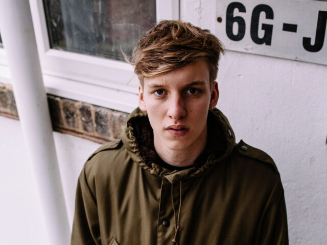 George Ezra casual portrait in green jacket perfect wallpapers for fans