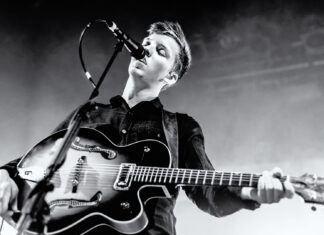 George Ezra live performance playing guitar black and white wallpaper