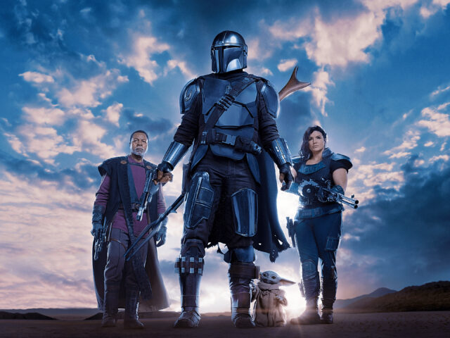 Gina Carano Mandalorian Character Wallpaper with Din Djarin Grogu and Greef Karga in Desert Scene