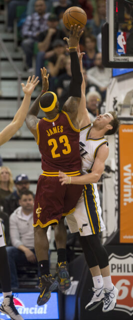 Gordon Hayward Defends Against LeBron James in Intense NBA Game Wallpaper