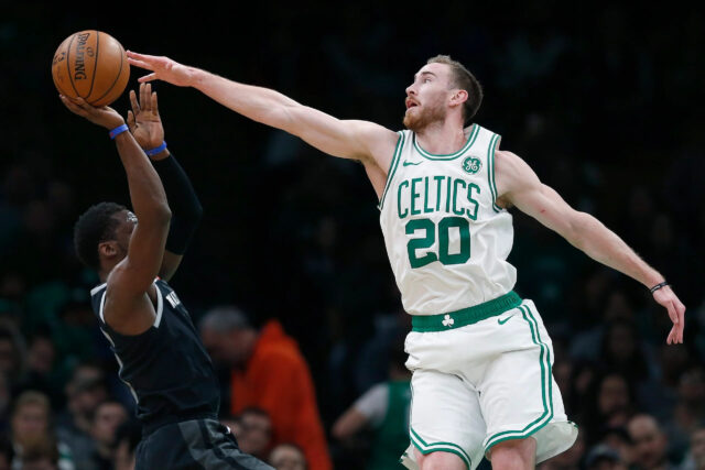 Gordon Hayward Defensive Block in Celtics Jersey Action Wallpaper