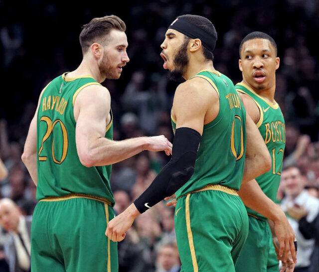 Gordon Hayward and Boston Celtics Players in Green Jerseys Celebrating on Court