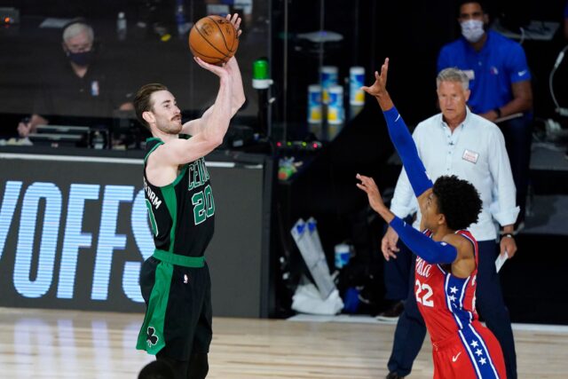Gordon Hayward shooting a jump shot against Philadelphia 76ers defensive player NBA Playoffs wallpaper