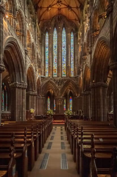 The cathedral interior shows detailed arches and colorful stained glass windows, HD Mobile Wallpaper