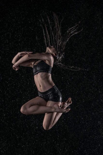 Graceful Contemporary Dance Movement in Wet Environment Dark Background Wallpapers